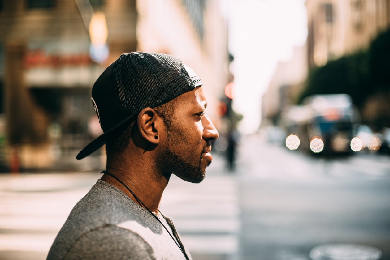 Traveler pausing to take in a busy city street scene